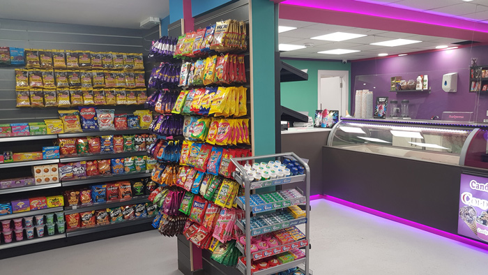 Colourful retail display of bagged sweets, snacks, and candy inside the Candy 
Cream dessert shop in Bathgate