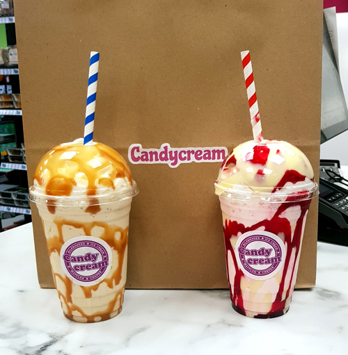 Two gourmet milkshakes topped with whipped cream, served at the Candy Cream 
dessert shop in Bathgate