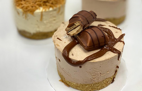 Close-up slice of rich chocolate fudge cake with ganache topping, from Candy 
Cream in Bathgate 